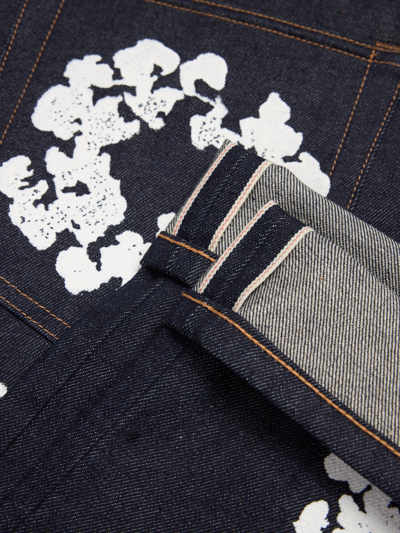 Denim tears, Loose-fitting cotton jeans with crown and selvedge print